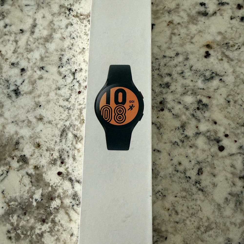 Samsung Galaxy 4 Smartwatch with Black Band and Orange Display